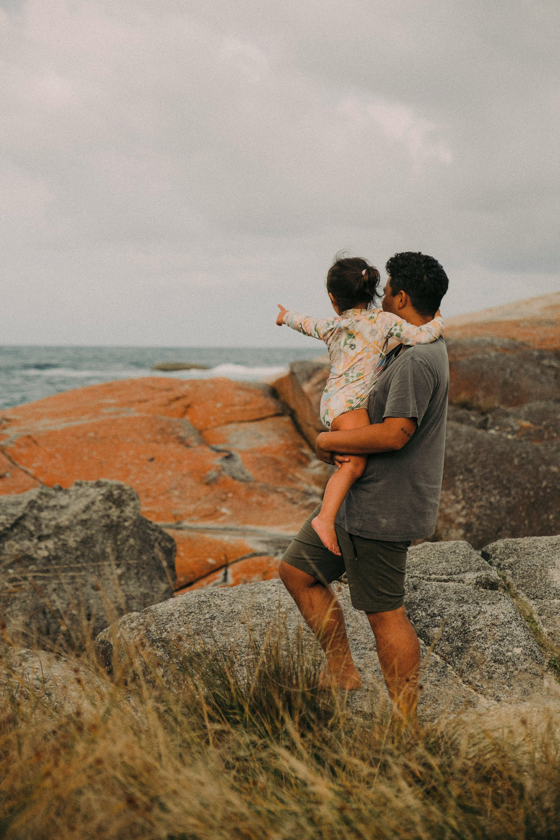 Family embracing in warm golden light — moving to Australia with children